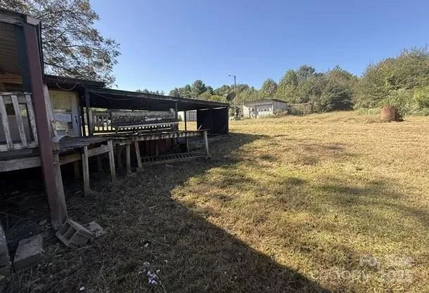 a view of a backyard with sitting area