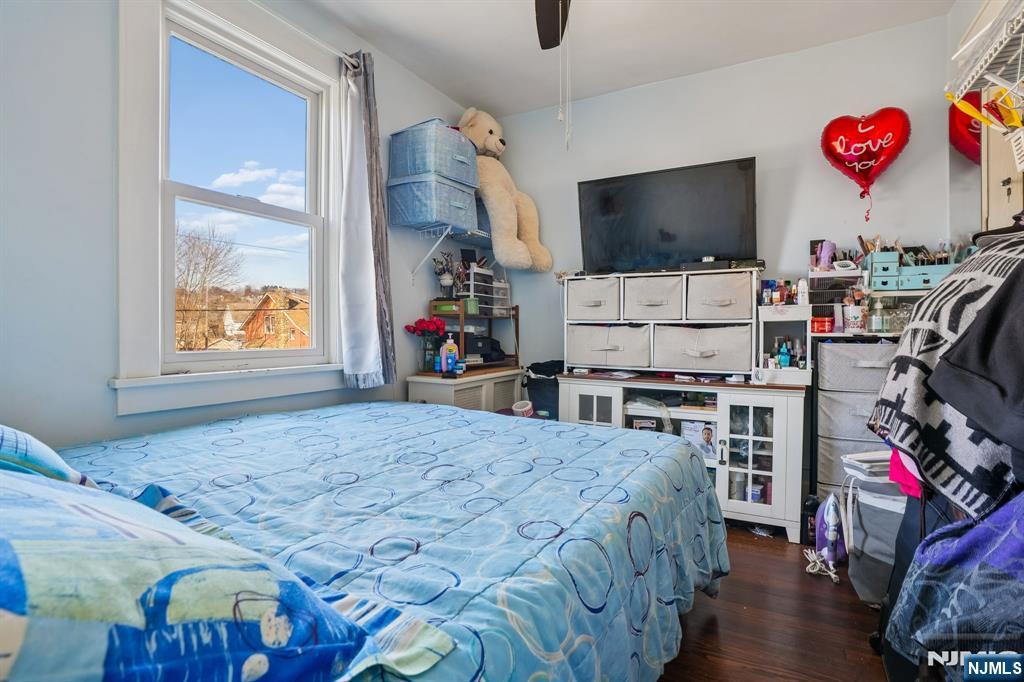 228 Totowa Road Totowa, NJ 07512 - Photo 19 of 39 a bedroom with bed and flat screen tv
