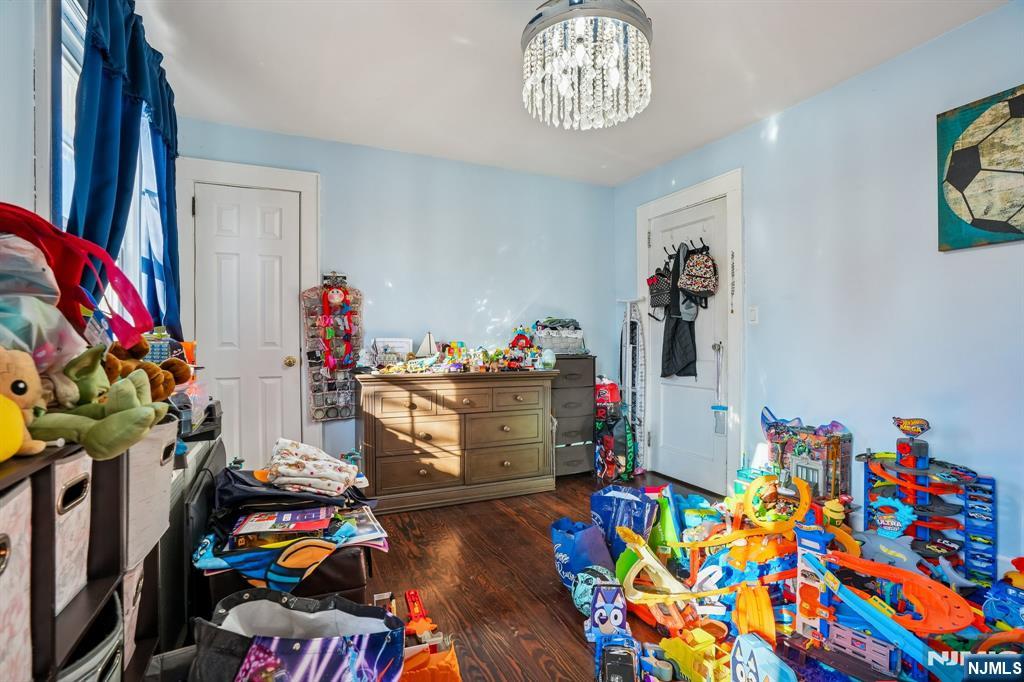 228 Totowa Road Totowa, NJ 07512 - Photo 24 of 39 a room with furniture and a wooden floor