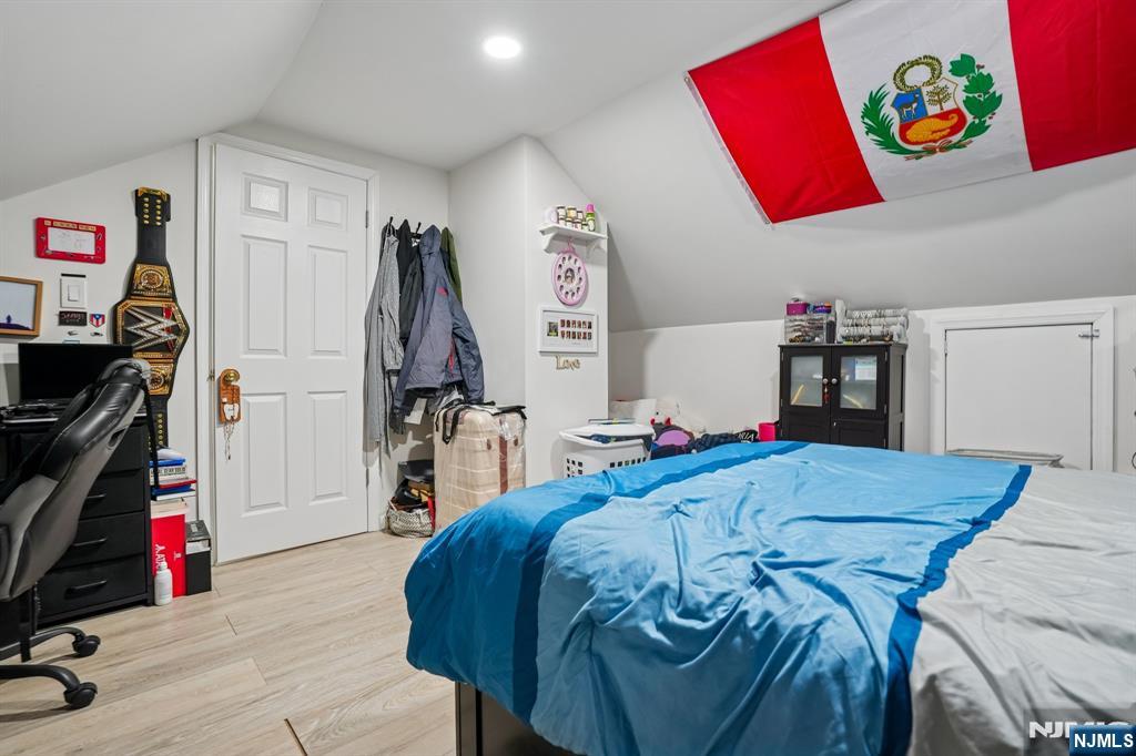 228 Totowa Road Totowa, NJ 07512 - Photo 27 of 39 a bed room with a bed and a walk in closet