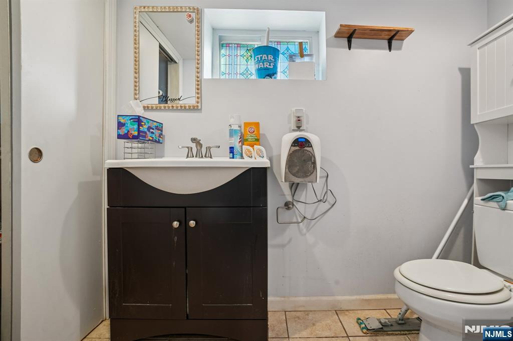 228 Totowa Road Totowa, NJ 07512 - Photo 30 of 39 a bathroom with a sink a toilet and shower