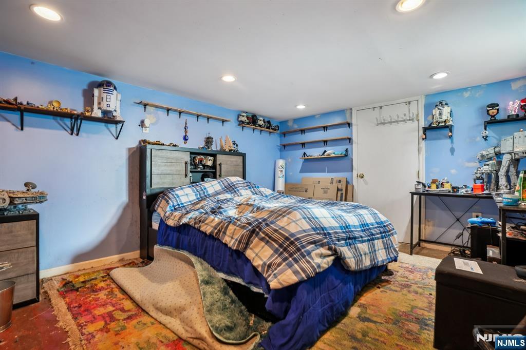 228 Totowa Road Totowa, NJ 07512 - Photo 32 of 39 a bedroom with a bed and a tv in it