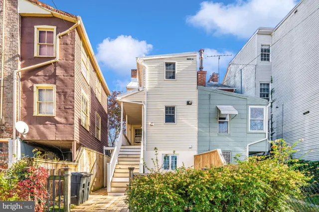 a view of a house with a tree
