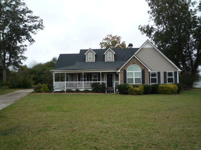 108 Ridge Crossing Temple, GA 30179 - Photo 1 of 1 a front view of a house with garden