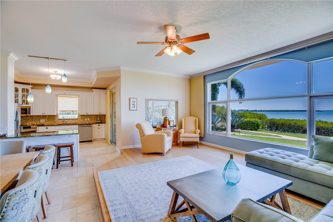 1701 Gulfstream Avenue, Unit 719 Fort Pierce, FL 34949 - Photo 12 of 36 a living room with furniture and a table