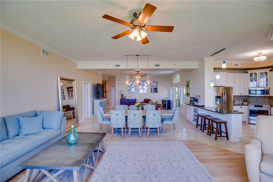 1701 Gulfstream Avenue, Unit 719 Fort Pierce, FL 34949 - Photo 13 of 36 a view of a dining room with furniture window and wooden floor