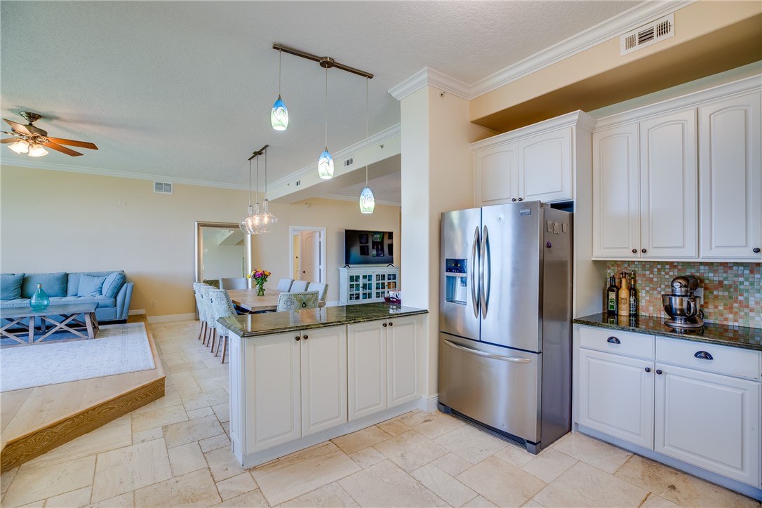 1701 Gulfstream Avenue, Unit 719 Fort Pierce, FL 34949 - Photo 16 of 36 a kitchen with a sink stainless steel appliances and cabinets