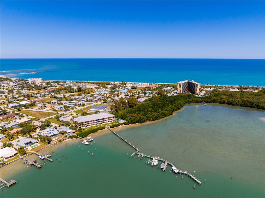 1701 Gulfstream Avenue, Unit 719 Fort Pierce, FL 34949 - Photo 2 of 36 an aerial view of a houses with a lake view
