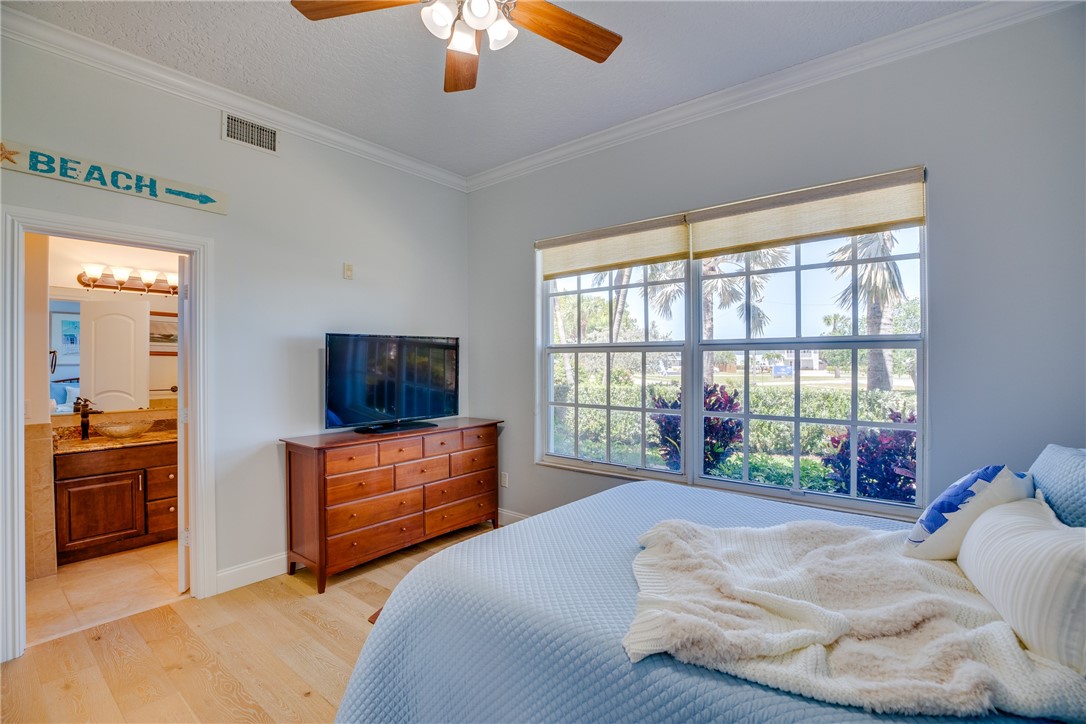 1701 Gulfstream Avenue, Unit 719 Fort Pierce, FL 34949 - Photo 21 of 36 a bedroom with a bed and a television