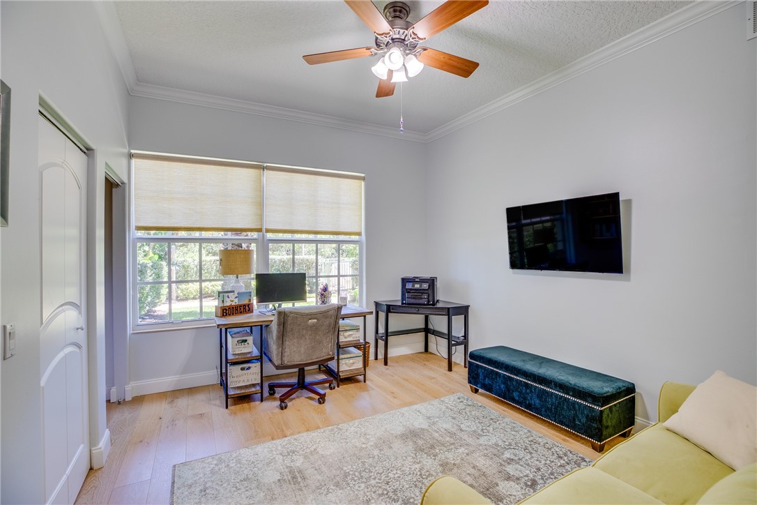 1701 Gulfstream Avenue, Unit 719 Fort Pierce, FL 34949 - Photo 24 of 36 a living room with furniture and a window