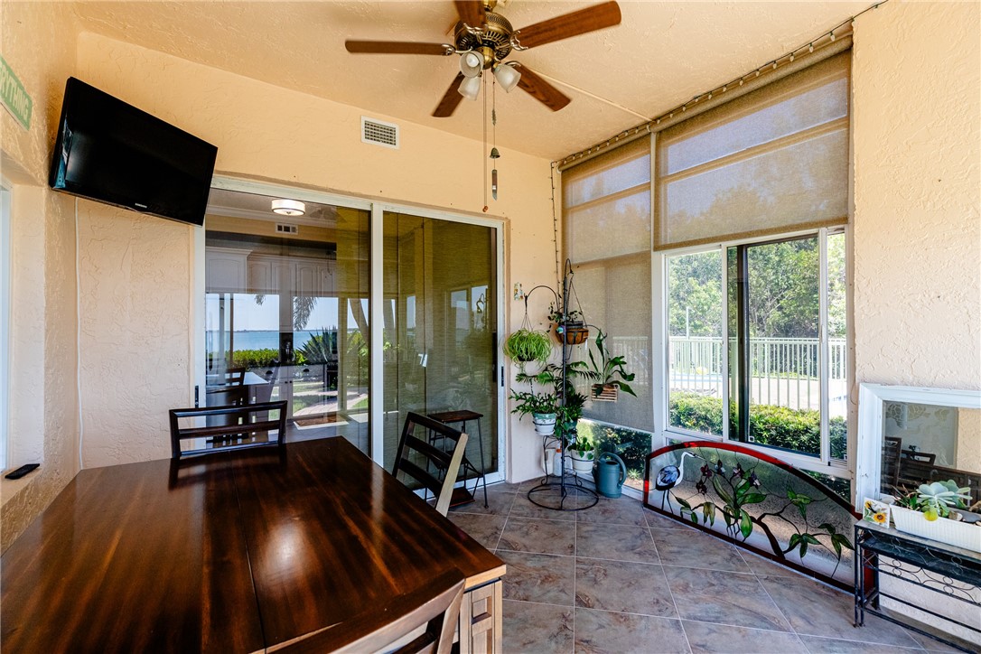 1701 Gulfstream Avenue, Unit 719 Fort Pierce, FL 34949 - Photo 27 of 36 a living room with furniture and a flat screen tv