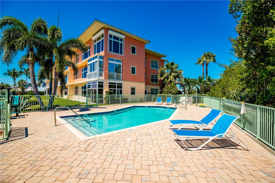 1701 Gulfstream Avenue, Unit 719 Fort Pierce, FL 34949 - Photo 30 of 36 a view of a house with swimming pool and sitting area