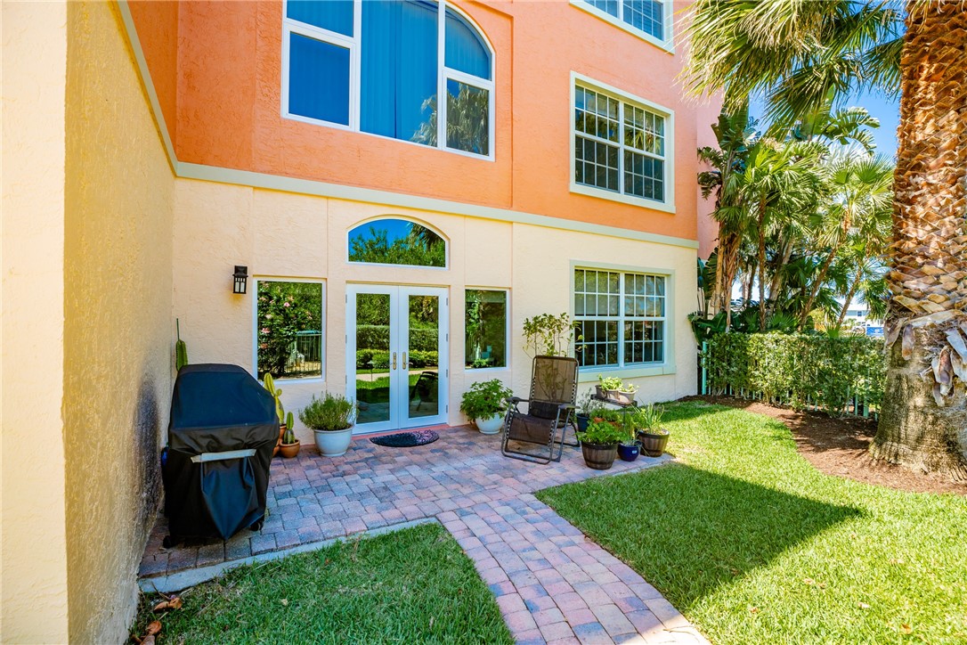 1701 Gulfstream Avenue, Unit 719 Fort Pierce, FL 34949 - Photo 31 of 36 a view of a house with backyard sitting area and garden