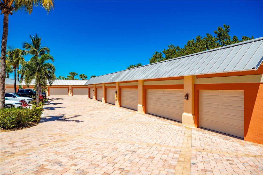 1701 Gulfstream Avenue, Unit 719 Fort Pierce, FL 34949 - Photo 32 of 36 a front view of a house with a yard