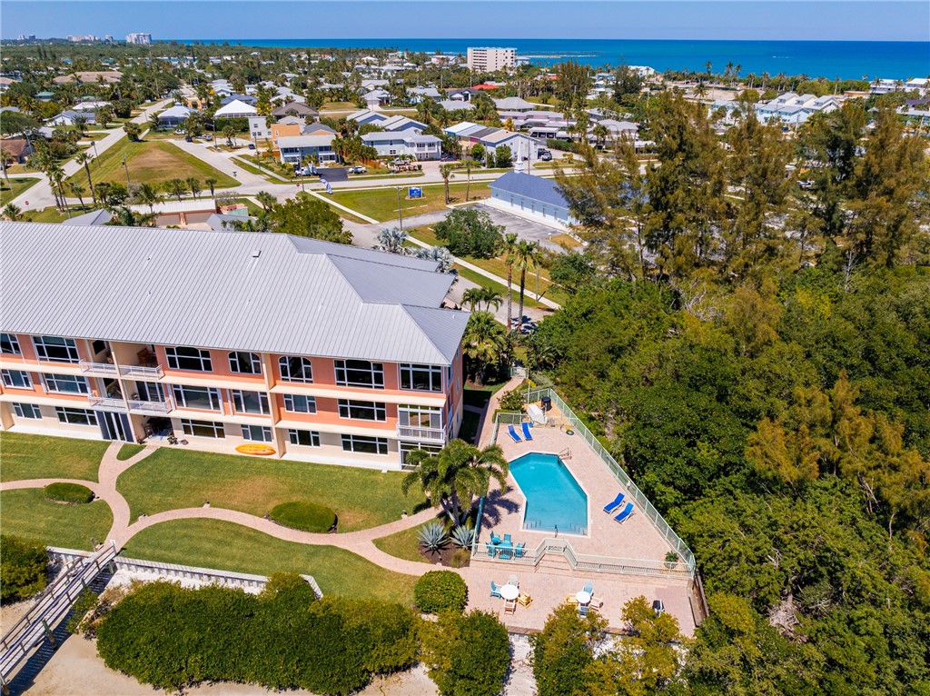 1701 Gulfstream Avenue, Unit 719 Fort Pierce, FL 34949 - Photo 33 of 36 an aerial view of a house with a swimming pool