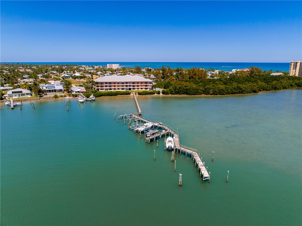 1701 Gulfstream Avenue, Unit 719 Fort Pierce, FL 34949 - Photo 35 of 36 a view of a lake with houses