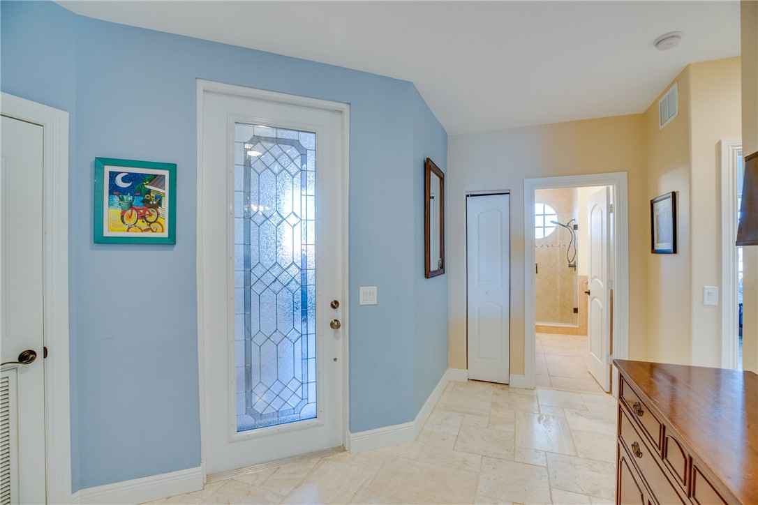 1701 Gulfstream Avenue, Unit 719 Fort Pierce, FL 34949 - Photo 4 of 36 a view of a hallway with wooden floor and windows