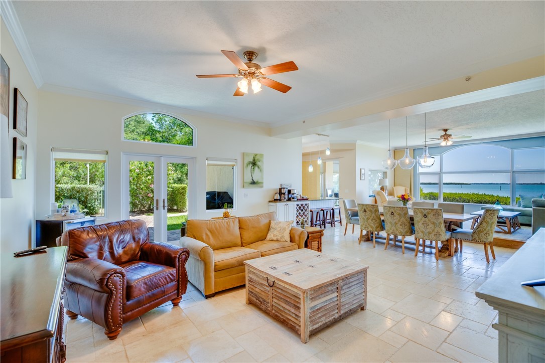 1701 Gulfstream Avenue, Unit 719 Fort Pierce, FL 34949 - Photo 6 of 36 a living room with furniture a table and chairs