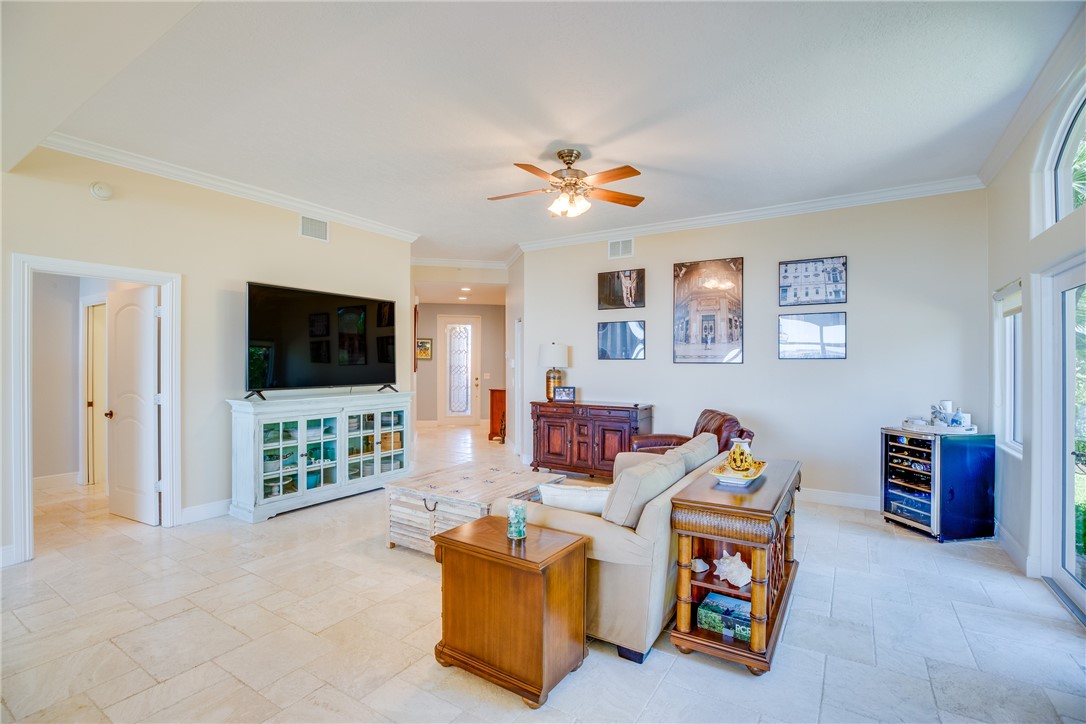 1701 Gulfstream Avenue, Unit 719 Fort Pierce, FL 34949 - Photo 9 of 36 a living room with furniture and a flat screen tv