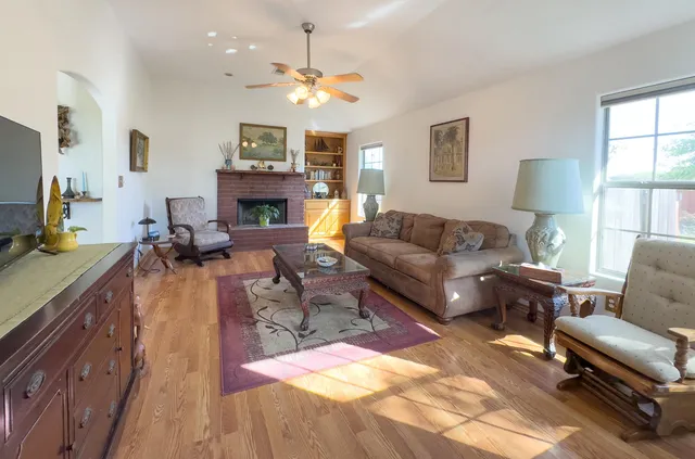 a living room with furniture and a fireplace