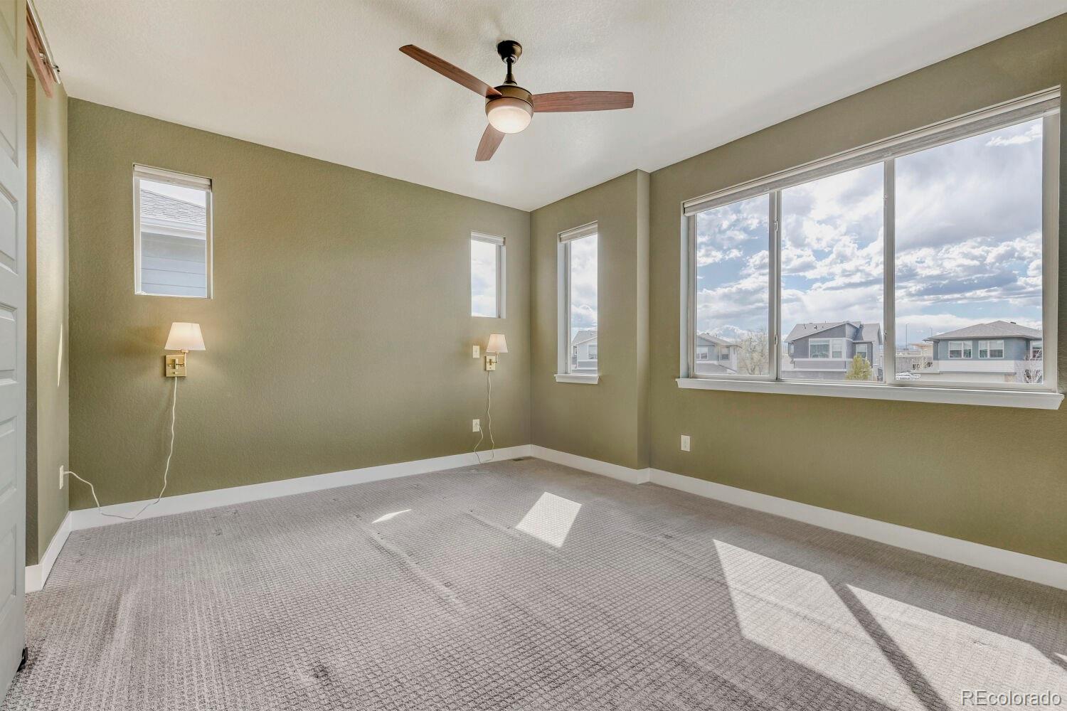 6850 Decatur Street Denver, CO 80221 - Photo 16 of 30 a view of an empty room with a window