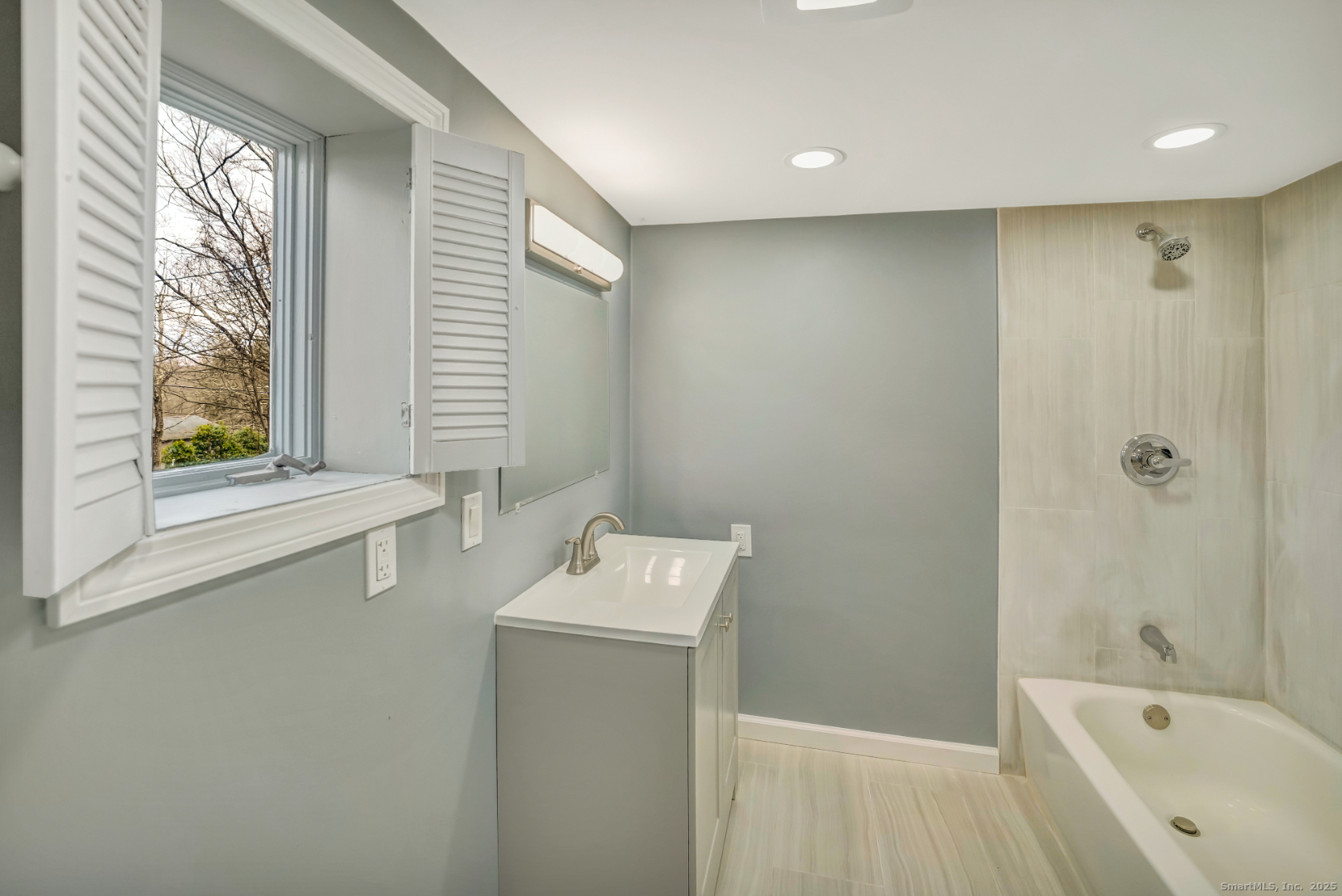 360 Old Sherman Hill Road Woodbury, CT 06798 - Photo 13 of 19 a bathroom with a bathtub sink and mirror