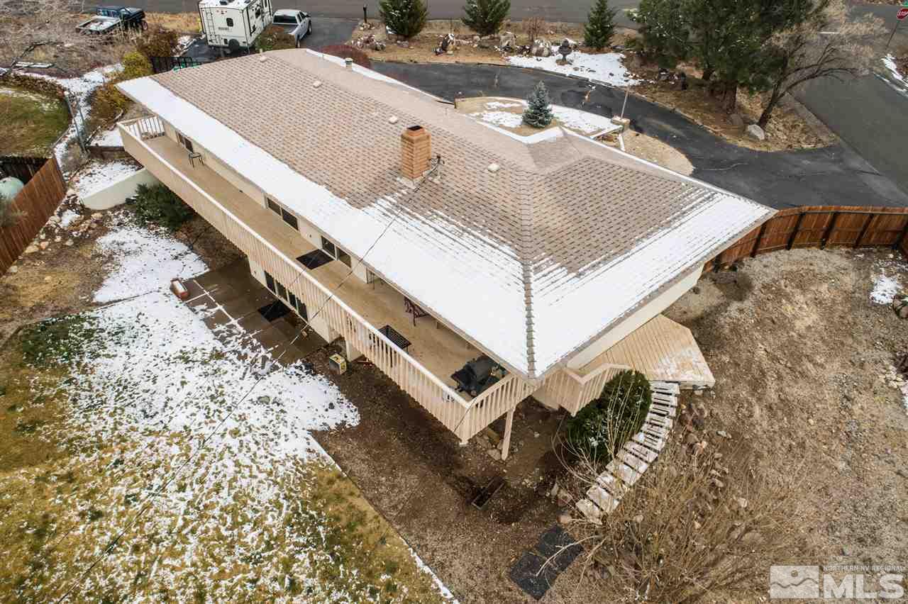 13965 Rancheros Drive Reno, NV 89521 - Photo 20 of 25 a view of a house with a backyard