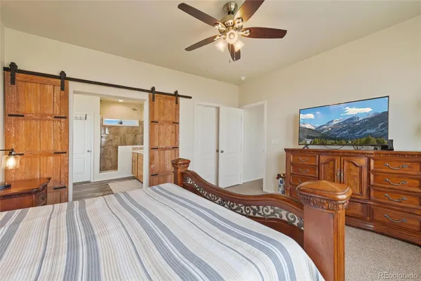 a bedroom with bed and window