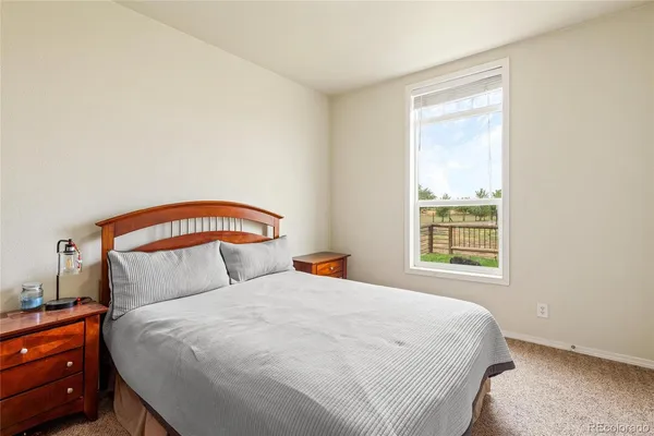 a bedroom with a bed and a mirror