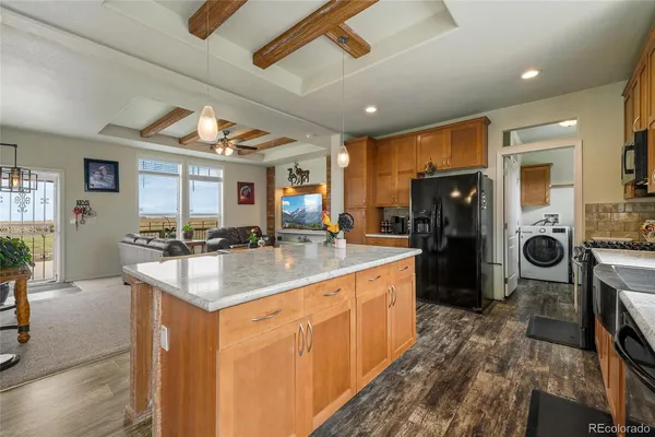 a large bed sitting in a room next to a window