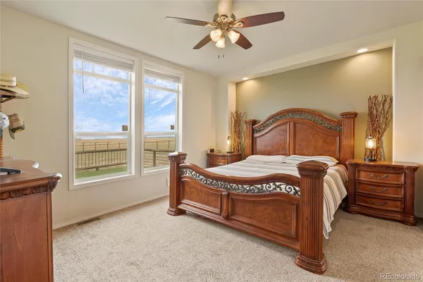 a spacious bathroom with a tub sink and mirror