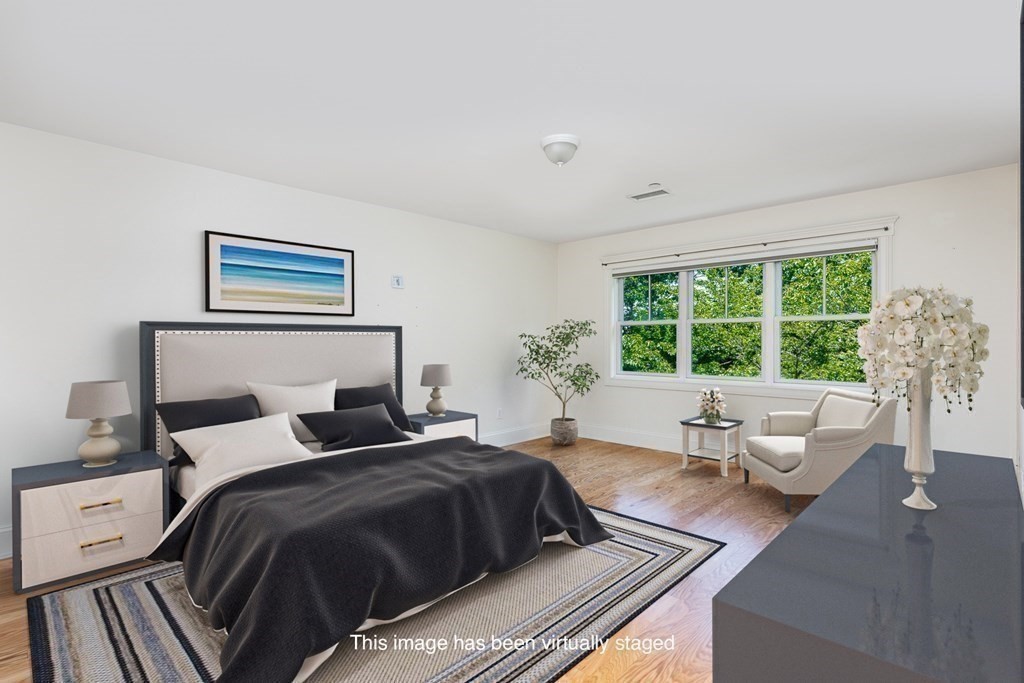 220 Humphrey Street, Unit 204 Marblehead, MA 01945 - Photo 14 of 29 a bedroom with a large bed and a large window