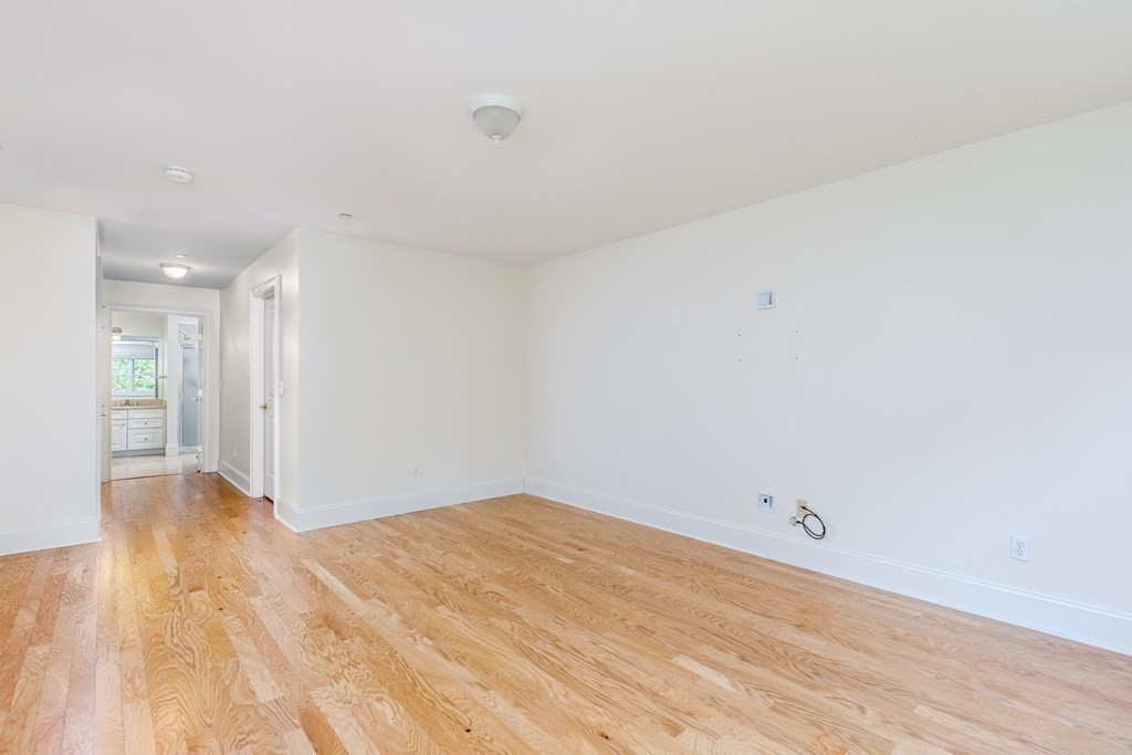 220 Humphrey Street, Unit 204 Marblehead, MA 01945 - Photo 16 of 29 a view of empty room with wooden floor