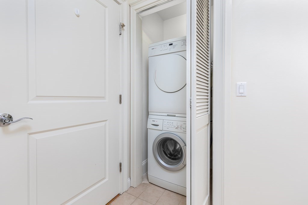 220 Humphrey Street, Unit 204 Marblehead, MA 01945 - Photo 22 of 29 a utility room with dryer and washer