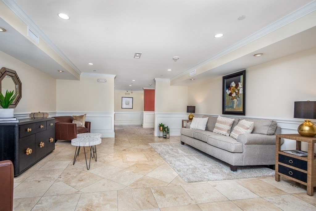 220 Humphrey Street, Unit 204 Marblehead, MA 01945 - Photo 26 of 29 a living room with furniture and wooden floor
