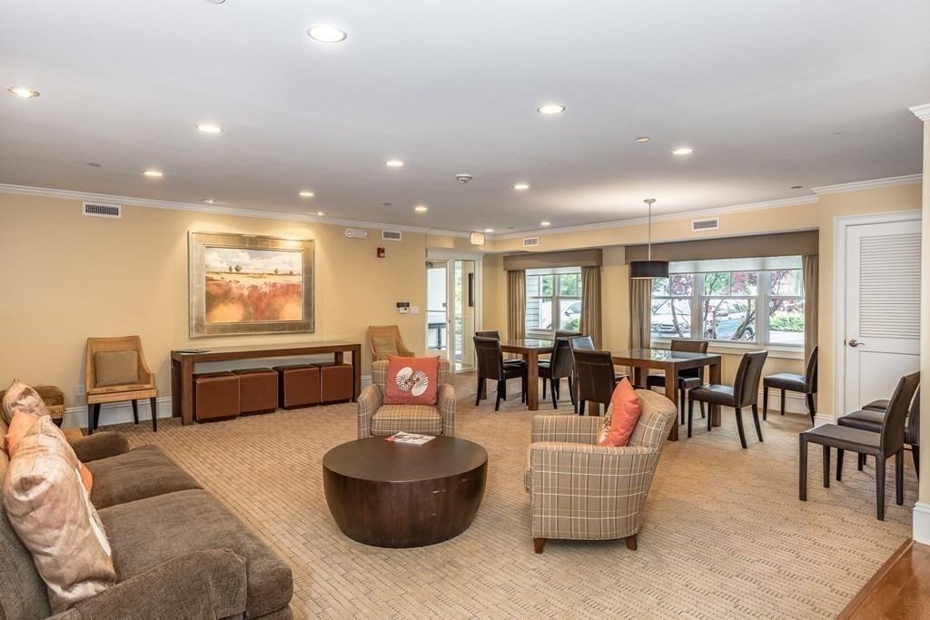 220 Humphrey Street, Unit 204 Marblehead, MA 01945 - Photo 28 of 29 a living room with furniture and a large window