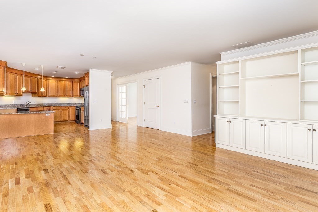 220 Humphrey Street, Unit 204 Marblehead, MA 01945 - Photo 7 of 29 a view of a kitchen with wooden floor