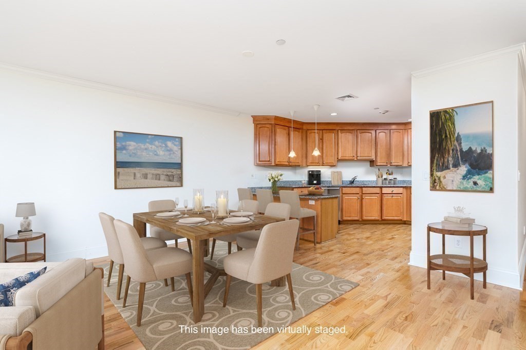 220 Humphrey Street, Unit 204 Marblehead, MA 01945 - Photo 8 of 29 a view of a dining room with furniture