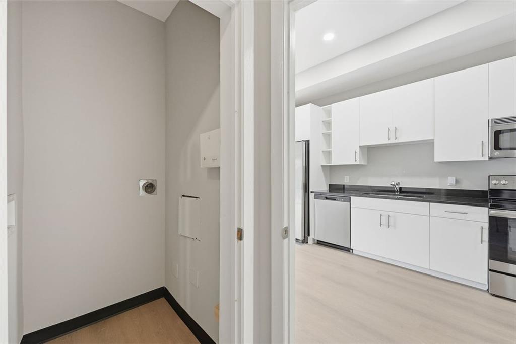 3400 Malone Drive, Unit 206 Atlanta, GA 30341 - Photo 12 of 31 a kitchen with granite countertop white cabinets and white appliances