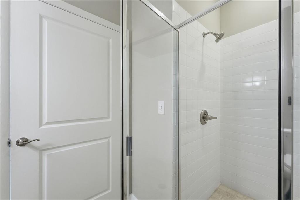3400 Malone Drive, Unit 206 Atlanta, GA 30341 - Photo 14 of 31 a bathroom with a glass shower door