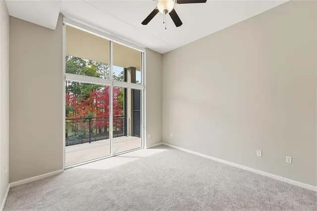 an empty room with windows and outdoor view