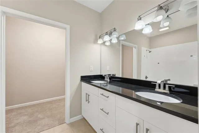 a close view of a sink and a mirror in a bathroom