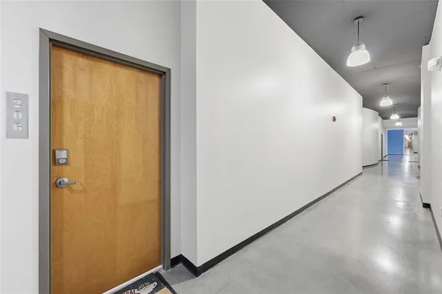 a view of a hallway with a large window