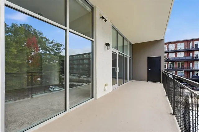 a view of a balcony with chairs