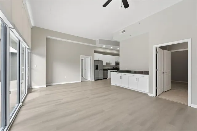 a view of kitchen with stainless steel appliances kitchen island
