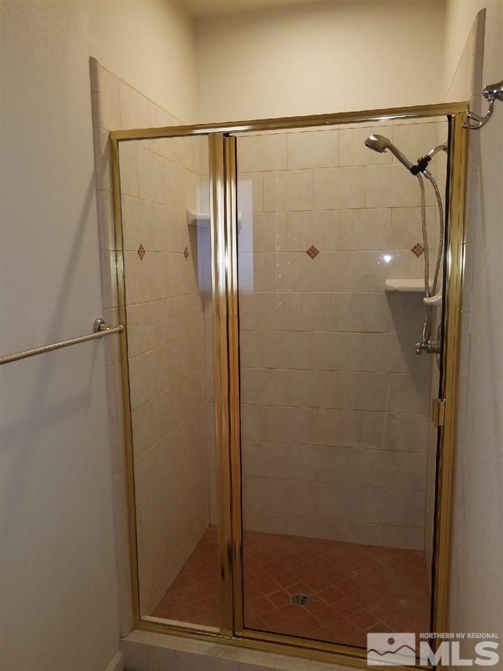 11000 Osage Road Reno, NV 89508 - Photo 18 of 20 a bathroom with a glass shower door
