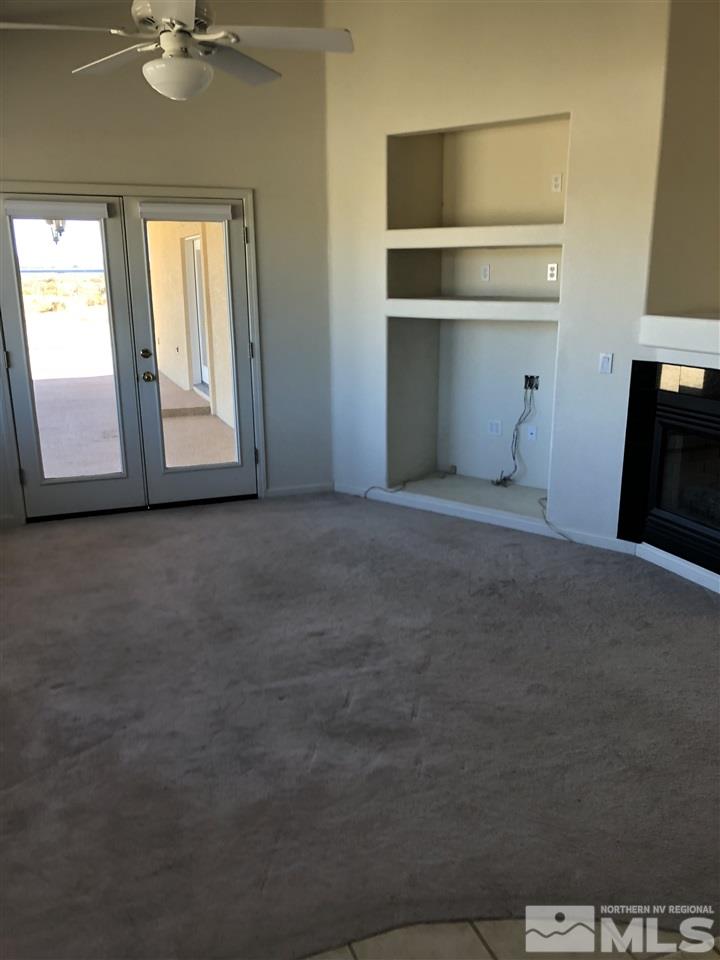 11000 Osage Road Reno, NV 89508 - Photo 3 of 20 a view of an empty room with a window