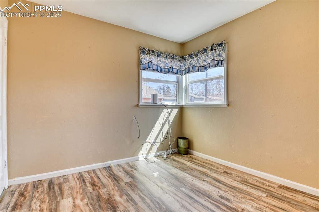 2409 Wahsatch Avenue Colorado Springs, CO 80907 - Photo 11 of 47 a view of a hallway with wooden floor