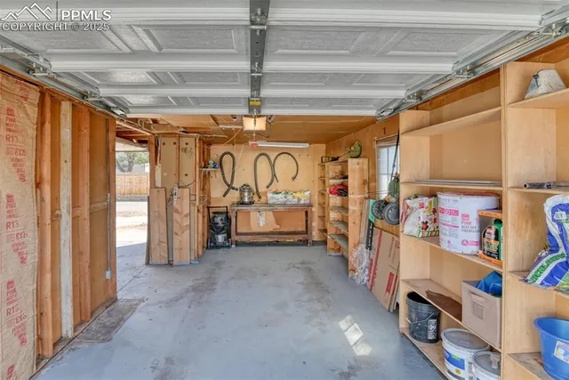 a view of a garage with storage