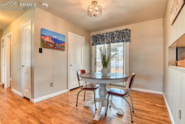 a view of a dining room with furniture window and wooden floor